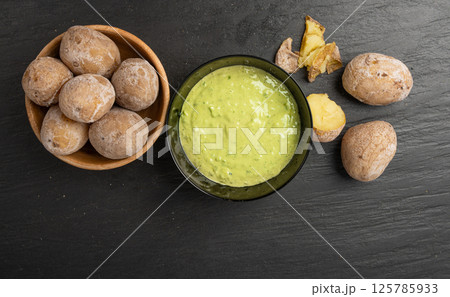 Red mojo rojo and green mojo verde sauces, traditional Tenerife dips, mojo picon dressing 125785933