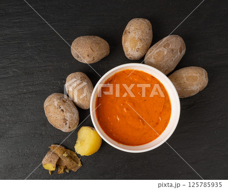Red mojo rojo and green mojo verde sauces, traditional Tenerife dips, mojo picon dressing 125785935