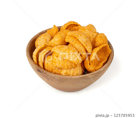Hummus chickpea chips, chick pea crisps pile, healthy orange snack, fried legume crunchies 125785953