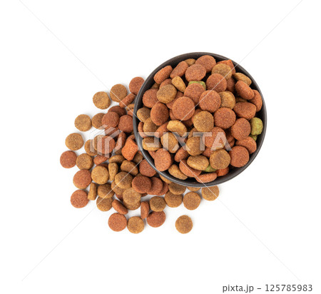 Dry pet food, dog color kibble pile, puppy meat and vegetable pellets, canine protein granules Dry pet food, dog color kibble pile, puppy meat and vegetable pellets, canine protein granules 125785983