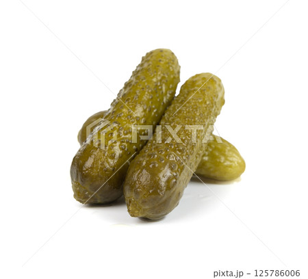 Gherkins isolated, pickled small cucumbers, tiny fermented food, little marinated canned vegetables Gherkins isolated, pickled small cucumbers, tiny fermented food, little marinated canned vegetables 125786006