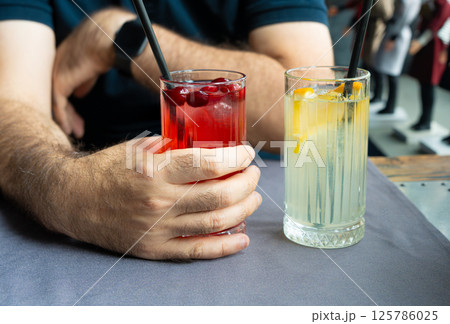 Ice lemonade in tall glass. Yuzu mocktail with lemon and soda, cool lime juice cocktail 125786025