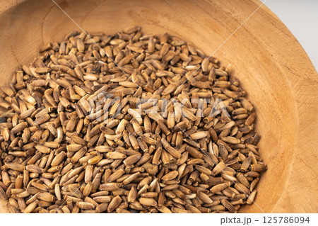 Milk thistle seeds, silybum marianum grains, dry blessed milkthistle fruits, variegated thistle kernels 125786094