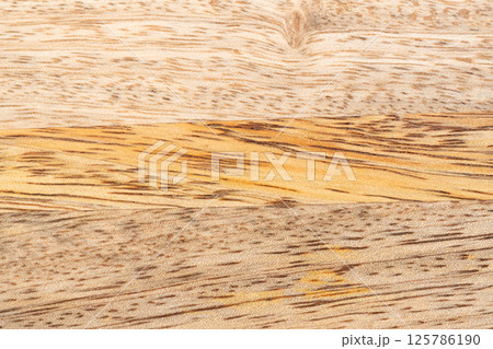 Mango wood texture top view. Kitchen wooden tray background, organic Mangifera indica veneer Mango wood texture top view. Kitchen wooden tray background, organic Mangifera indica veneer 125786190