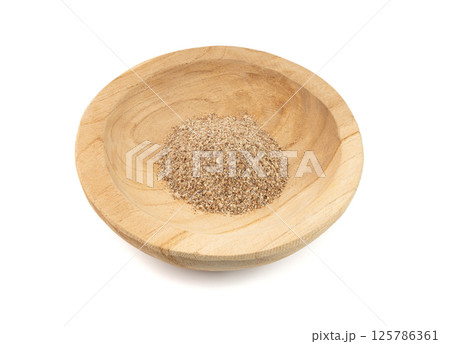 Milk thistle seeds powder, crushed silybum marianum grains pile, milled dry blessed milkthistle 125786361