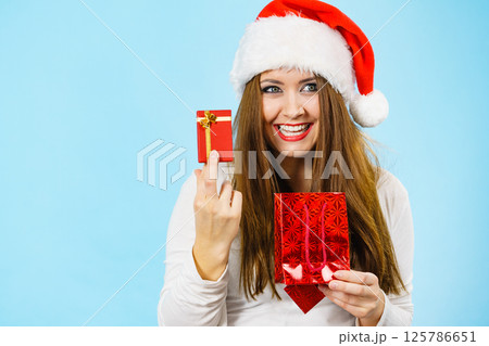 Happy Christmas woman holds red gift box Happy Christmas woman holds red gift box 125786651