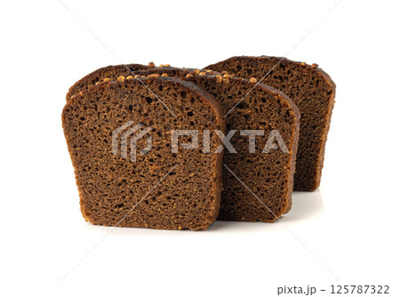 Black rye bread isolated, dark brown sliced loaf, sourdough borodinsky rugbrod square slices 125787322