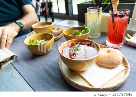 Borscht or borsch in bowl, Ukrainian beetroot soup. Red chowder thick borscht with sour cream 125787542