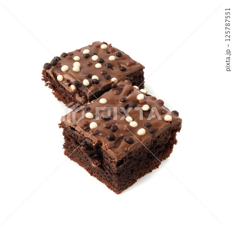 Chocolate brownie cake sprinkled with white and dark balls, classic birthday brownie square piece Chocolate brownie cake sprinkled with white and dark balls, classic birthday brownie square piece 125787551