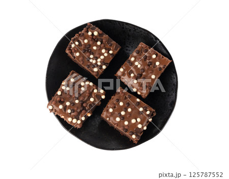 Chocolate brownie cake sprinkled with white and dark balls, classic birthday brownie square piece Chocolate brownie cake sprinkled with white and dark balls, classic birthday brownie square piece 125787552