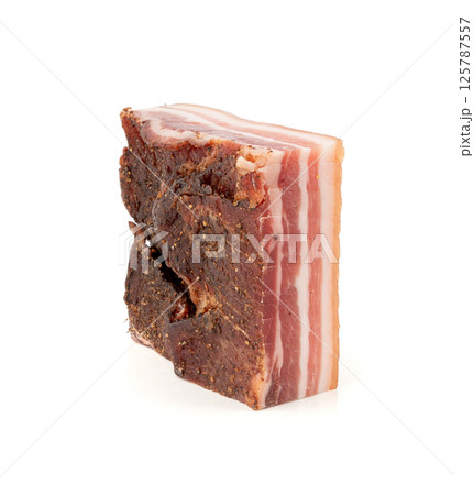 Cured carbonara pork isolated, raw smoked bacon, streaky brisket on white background Cured carbonara pork isolated, raw smoked bacon, streaky brisket on white background 125787557