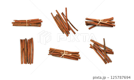 Macro Foto of Dry Cinnamon Sticks Isolated on White Background Macro Foto of Dry Cinnamon Sticks Isolated on White Background 125787694