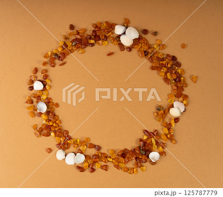 Amber stones, polished orange gemstones, natural Baltic amber gems, golden fossilized tree resin Amber stones, polished orange gemstones, natural Baltic amber gems, golden fossilized tree resin 125787779