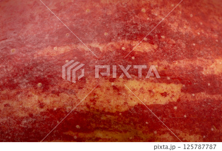 Red apple skin macro texture. Honeycrisp fruit surface close up, fresh spotted and striped apple Red apple skin macro texture. Honeycrisp fruit surface close up, fresh spotted and striped apple 125787787