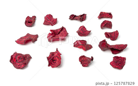 Dry beetroot chips isolated, dried sliced red beet flakes pile, beet root pieces and chips 125787829