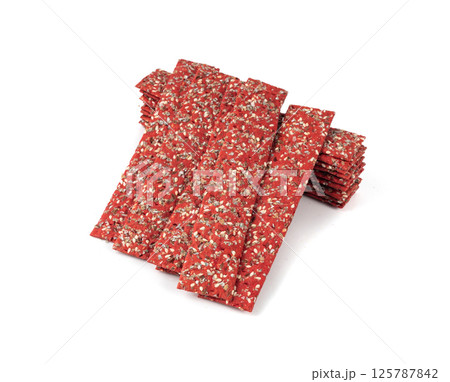 Beetroot crackers, thin rusk beet root bread, red diet multigrain crispbread, various seeds 125787842