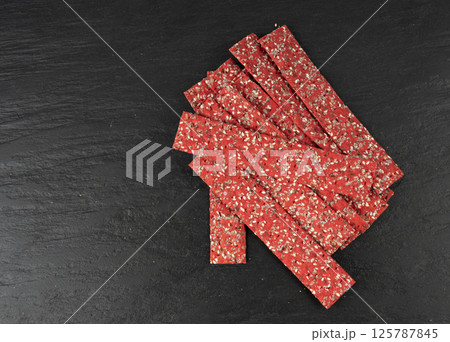 Beetroot crackers, thin rusk beet root bread, red diet multigrain crispbread, various seeds Beetroot crackers, thin rusk beet root bread, red diet multigrain crispbread, various seeds 125787845