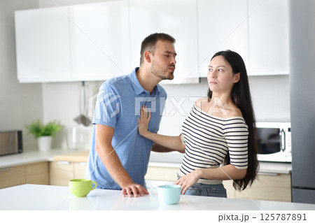 Man trying to kiss an asian woman who reject him 125787891
