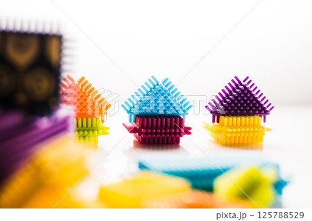 Educational children's construction set on a light background. Children's game constructor. 125788529