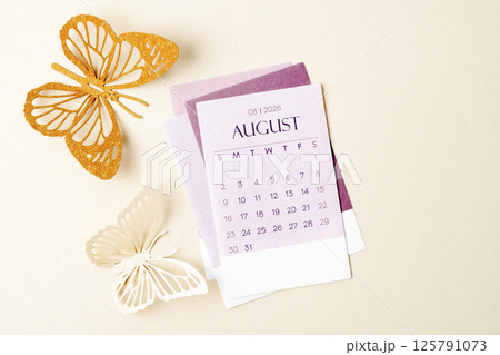 August 2026 calendar page with craft paper cutting butterfy shape. August 2026 calendar page with craft paper cutting butterfy shape. 125791073