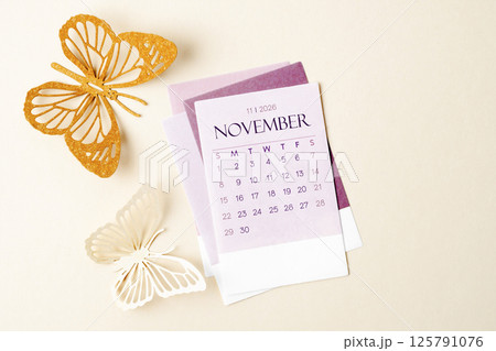 November 2026 calendar page with craft paper cutting butterfy shape. 125791076