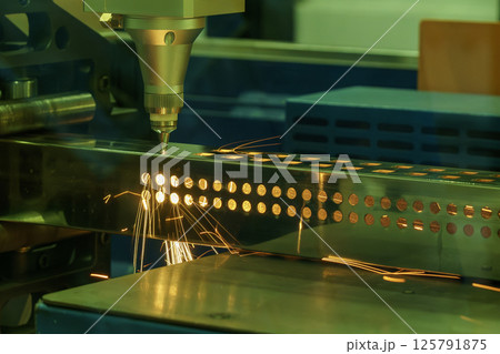 The fiber laser cutting machine cut the square shape stainless steel tube with sparkling light. The fiber laser cutting machine cut the square shape stainless steel tube with sparkling light. 125791875
