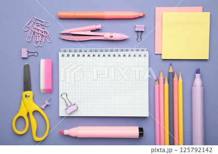 Studio shot of school supplies on purple background. Studio shot of school supplies on purple background. 125792142