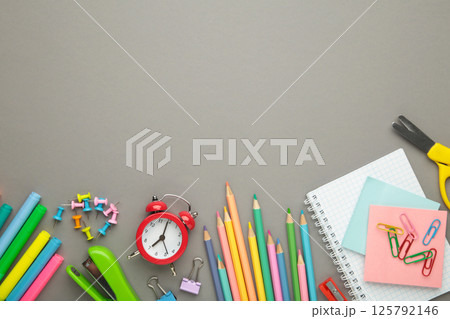 Studio shot of school supplies on grey background. Space for text 125792146