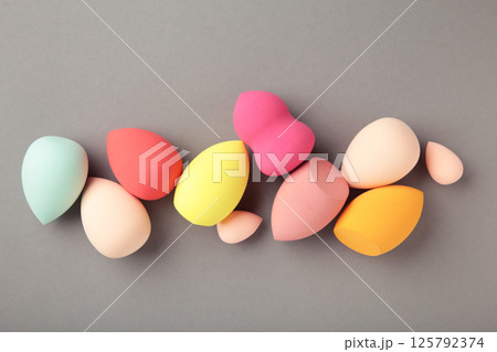 Beauty blender on grey background. Makeup products. Beauty concept. Beauty blender on grey background. Makeup products. Beauty concept. 125792374