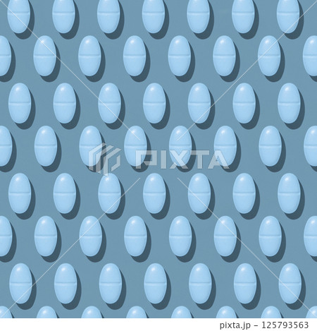 Blue medical pills on blue top view, hard light, creative pattern. Healthcare products Blue medical pills on blue top view, hard light, creative pattern. Healthcare products 125793563