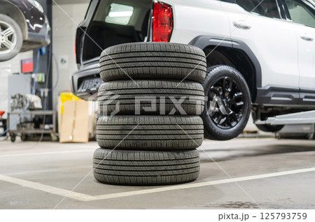 Changing tires for a car according to the season. Changing tires for a car according to the season. 125793759