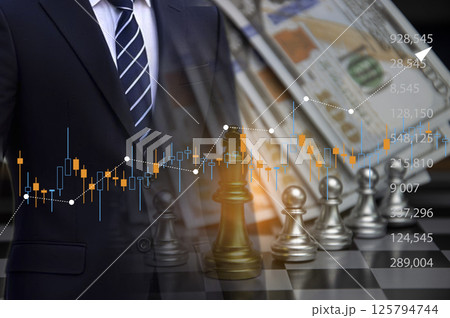 The concept of a businessman trading stocks, chess represents winning. 125794744
