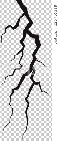 An intricate network of jagged, chaotic cracks streaks across a stark, shadowy plane, creating a visually striking and abstract texture. 125795389