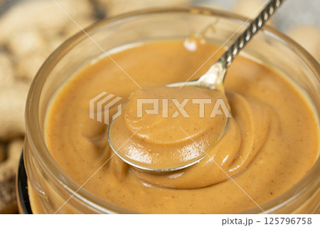 Close Shot of Spoonful of Peanut Butter Close Shot of Spoonful of Peanut Butter 125796758