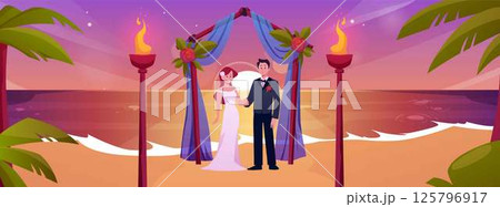 Beach wedding ceremony at sunset, with arch, bride, groom and torches. 125796917