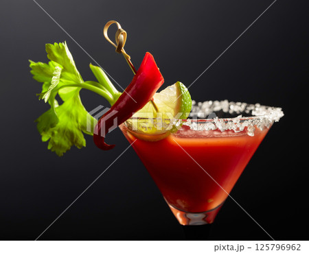 Bloody Mary cocktail with celery, lime, and pepper. 125796962