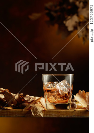 Whiskey in frozen glass with ice. Whiskey in frozen glass with ice. 125796973