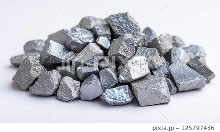 Metallic minerals piled together showcasing varied shapes and textures under bright lighting in a laboratory setting 125797436