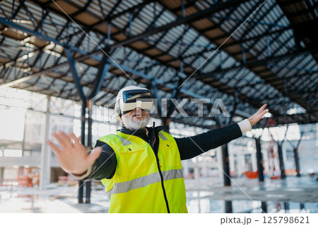 Engineer using virtual reality to inspect building progress. Engineer using virtual reality to inspect building progress. 125798621