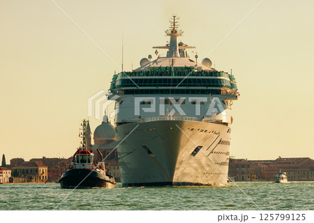 Cruise ship and tugboat in the venetian lagoon, Italy. Cruise ship and tugboat in the venetian lagoon, Italy. 125799125
