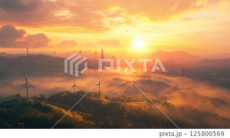 Sunrise over city with fog and wind turbines. Sunrise over city with fog and wind turbines. 125800569