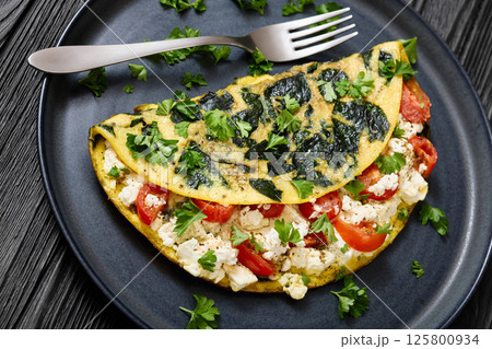 Spinach Onion Goat Cheese Cherry Tomato Omelette Spinach Onion Goat Cheese Cherry Tomato Omelette 125800934