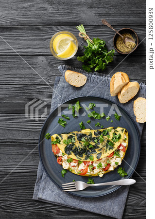 Spinach Onion Goat Cheese Cherry Tomato Omelette Spinach Onion Goat Cheese Cherry Tomato Omelette 125800939