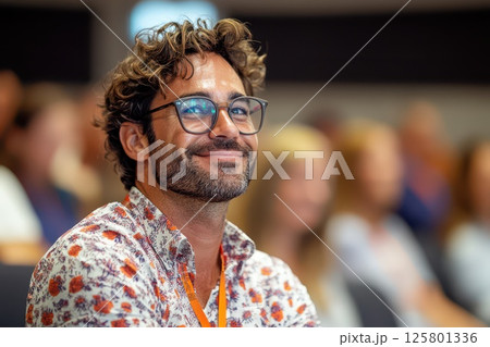 Smiling man engaging with audience 125801336