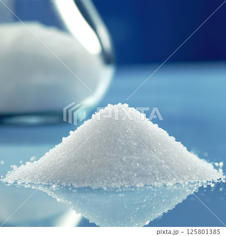 Close up view of sugar pile on reflective surface 125801385