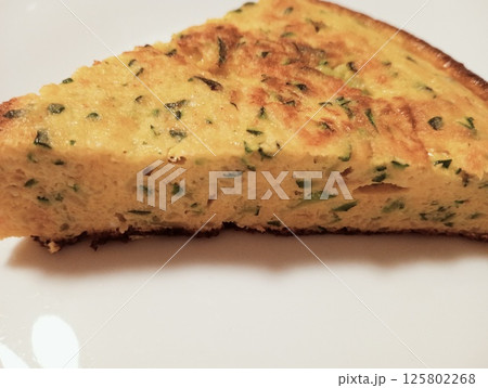 omelette with onions and courgettes 125802268