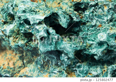 Natural malachite structure, it is a copper carbonate hydroxide mineral 125802477