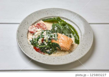 Creamy Salmon with Spinach, Tomato, and Basil Creamy Salmon with Spinach, Tomato, and Basil 125803227