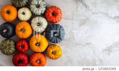 A collection of colorful decorative pumpkins on a light background. Generative AI 125803269