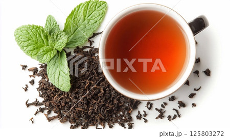 Aromatic cup of black tea with fresh mint leaves and scattered dry tea on a white background. Generative AI 125803272